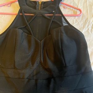 Black homecoming dress with sheer cut outs and gold zipper in back.